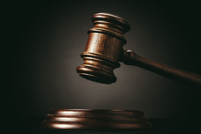 Dark brown gavel with dark background